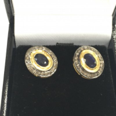 Pair of oval sapphire and diamond halo studs in gold plated silver. Sapphires 0.45ct and 0.25ct diamonds approximately. Postage A