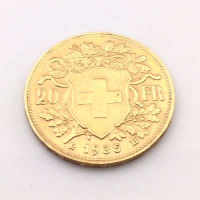 A 1935 20 Swiss franc coin. 6.46g Postage A