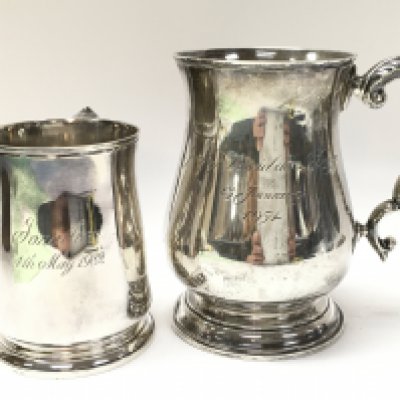Two silver hallmarked tankards 10 & 13cm tall. Postage category B