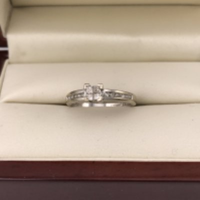 A 9ct white gold princess and brilliant cut diamond set ring. Approx weight 2.72 grams, approx size O.