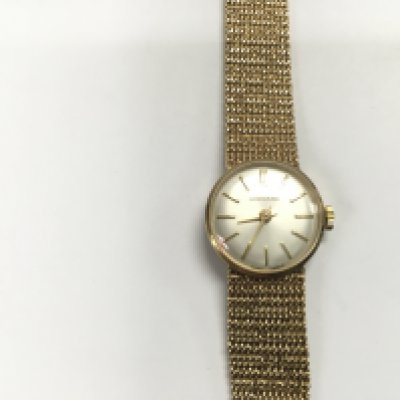 A vintage 9ct gold Garrard ladies wrist watch. Winds and runs. 32.35g