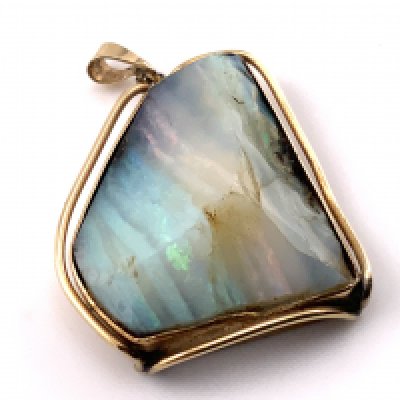 A 9ct gold mounted opal (cross section). 25mm x 21mm. (A) 7.98g.