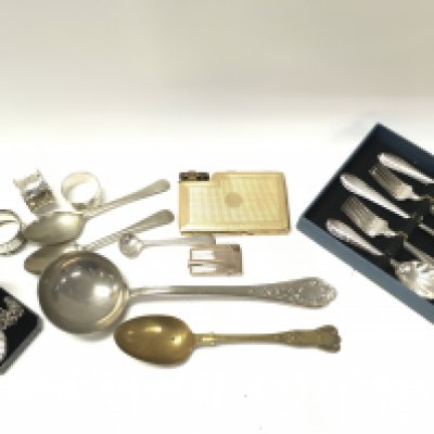 A collection of silver napkin rings and silver plated items including cutlery. Postage category B