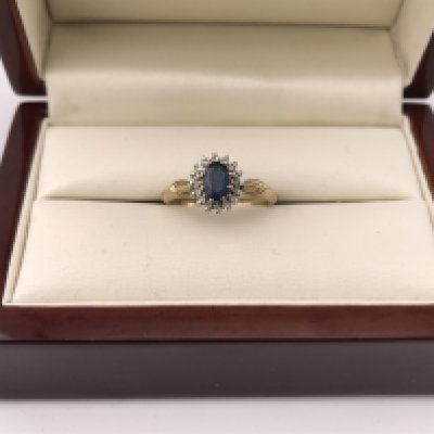 A 9ct diamond and sapphire ring. Approx weight 2.27 grams, approx size K.