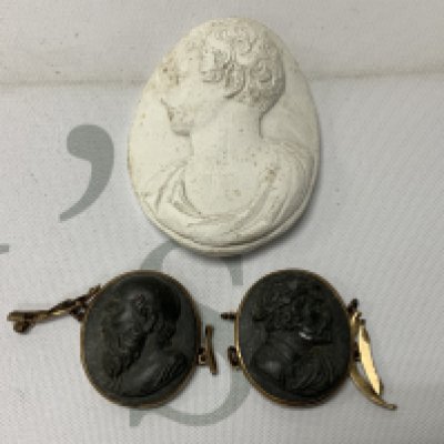 2 antique carved lava cameos with yellow metal mounts together with a plaster relief cameo in roman form. (A). NO RESERVE