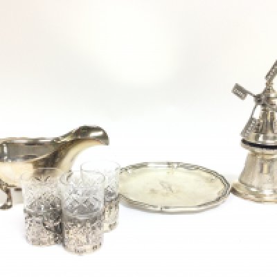 A collection of silver hallmarked items including a small dish, windmill ornament, sauce boat and silver glass cup holders. This lot cannot be posted