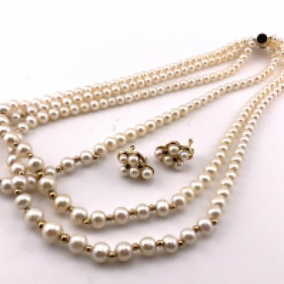 A 14ct gold clasped 3 strand necklace, interspersed with 14ct gold beads, together with a pair of 14ct gold and pearl and sapphire sud clip design earrings. (Clip missing). (A)