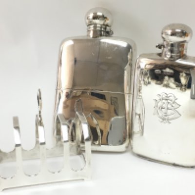 Hallmarked silver hip flasks and a silver toast rack, postage category B