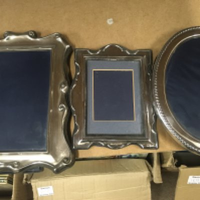 Three silver photo frames..