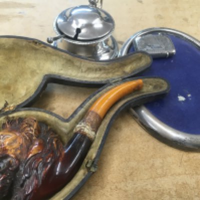 A silver vesta , a pipe in the form of a lion&rsquo;s head . Together with a small oval photo frame and a silver Cruet .