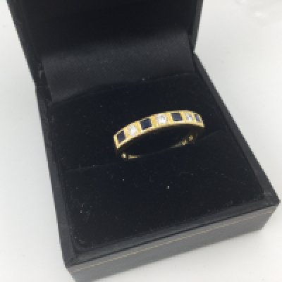 An 18ct gold diamond and sapphire ring approx weight 3.1 grams, approx size n.