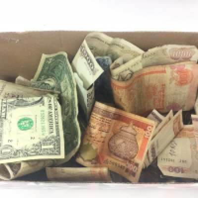 A collection of mixed world notes and coins. Postage category B