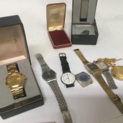 A collection of used worn Seiko watches including a gold plated day date boxed and gold plated pocket watch and chain.