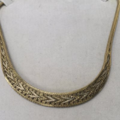 A 9 ct gold two tone necklace in a fitted box 40 grams.