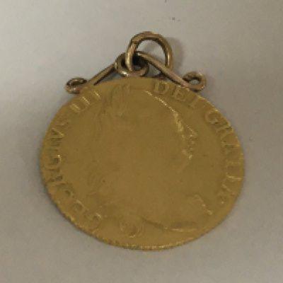 A Georgian mounted gold Guinea.