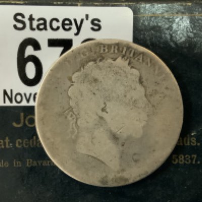 A worn example of a George III (1760-1820),Crown, 1818 (A)