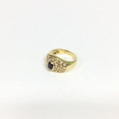 A sapphire and diamond ring in yellow 18ct gold stamped 750. Approx weight 6.40 grams, size N.