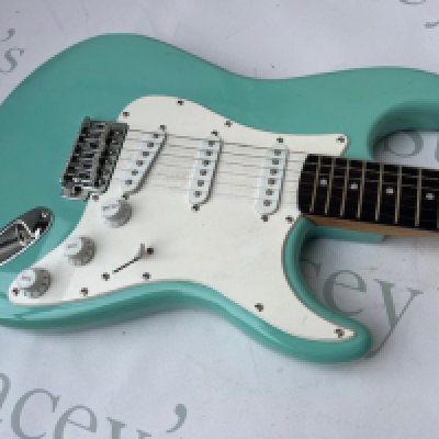 A Squire Stratocaster by Fender in Ice Blue finish in good overall condition comes with Fender gig bag.  <a href="https://www.the-saleroom.com/en-gb/auction-catalogues/staceys-auctioneers-and-valuers/catalogue-id-srsta10351/lot-7b96b84d-a29a-4707-9a2c-b2410115201a"> Click Here to Register to bid </a>