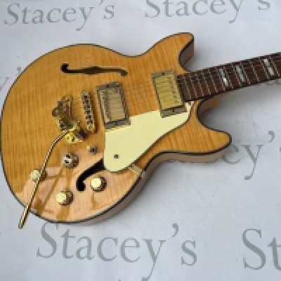 A Jay Turser Semi Acoustic ES style guitar with flame top and gold parts - very good unplayed condition throughout. No fret wear and no obvious signs of any wear, damage or restoration. Comes with non original gig bag.  <a href="https://www.the-saleroom.com/en-gb/auction-catalogues/staceys-auctioneers-and-valuers/catalogue-id-srsta10351/lot-39d70da8-ff1f-441c-9179-b24101152083"> Click Here to Register to bid </a>