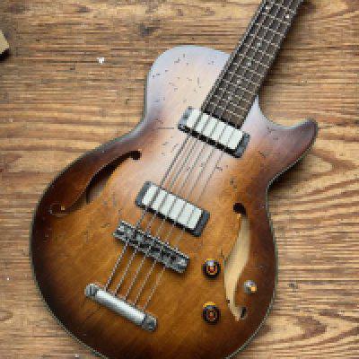 An Ibanez Artcore 5 String Bass Guitar with distinctive Ibanez finish in non original case - condition very good.  <a href="https://www.the-saleroom.com/en-gb/auction-catalogues/staceys-auctioneers-and-valuers/catalogue-id-srsta10351/lot-3a890001-dbea-41f6-ab36-b2410115235c"> Click Here to Register to bid </a>