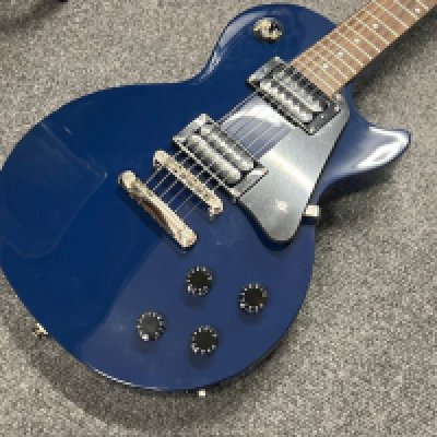 An as new condition Epiphone Les Paul Studio electric guitar in Blue. Twin Humbuckers and rosewood board with chrome parts and brightwork. As new condition unplayed with plastic still on the pick guard. <a href="https://www.the-saleroom.com/en-gb/auction-catalogues/staceys-auctioneers-and-valuers/catalogue-id-srsta10351/lot-5b9d782c-f5f4-4659-a688-b241011524bf"> Click Here to Register to bid </a>