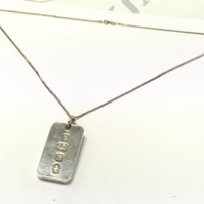 A heavy silver ingot On a silver chain, postage category A