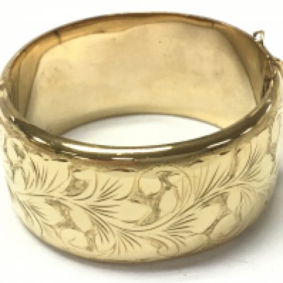 A heavy rolled gold bangle , 53g. Postage category A