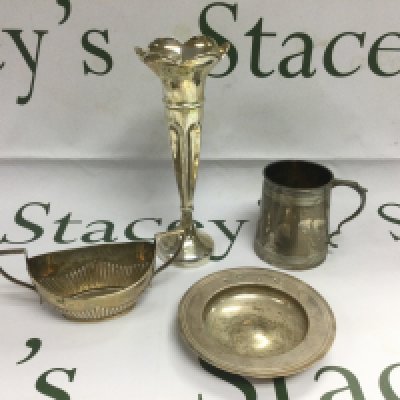 Dour silver items comprising a bud vase, alms dish, tankard and a two handled sugar bowl. Shipping category B.