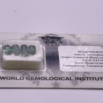 Certified collection of 4 octagonal cut green tourmaline, boxed. Tourmalines 3.52ct. Cert number. WGI9634154672. Postage category A.