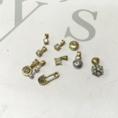 An assortment of 18ct gold stone set pendants. Approx weight 10.9 grams.