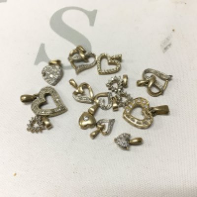 A mixed assortment of 9ct gold stone set heart pendants. Approx weight 11 grams.