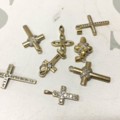 A mixed assortment of yellow metal stone set crosses. Approx weight 15.4 grams.