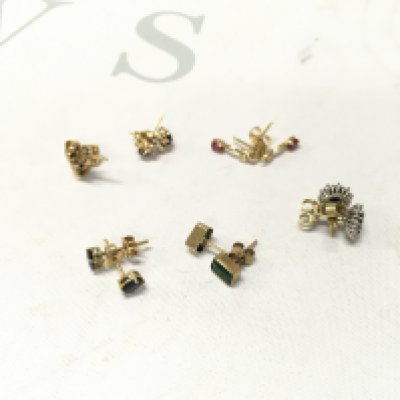 Six pairs of 18ct gold stone set studs. Approx weight 8.2 grams.