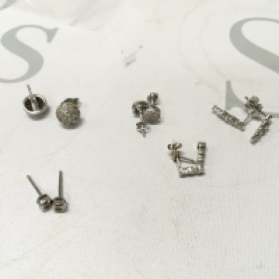 Five pairs of stone set 9ct white gold studs. Approx weight 6.1grams.