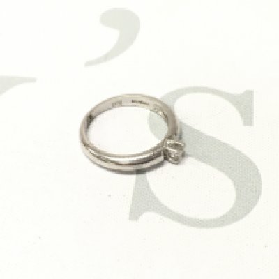 An 18ct white gold solitaire ring. Approx weight 4.4 grams, Approx size N 1/2.