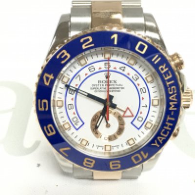 A Rolex yacht master II 2015 comes with box papers and swing tags. 44mm case with steel and gold oyster bracelet. White dial. Seen running. Model 116681.