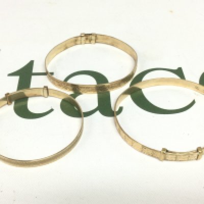 A 9ct gold bracelet with a metal core and two rolled gold bracelets (3). Shipping category A.