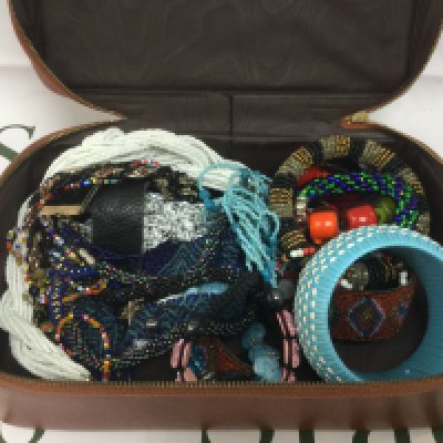 A collection of beaded necklaces and bracelets. Shipping category B.