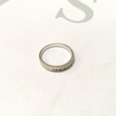 An 18ct white gold stone set band. Approx size P, Approx weight 3.4 grams.