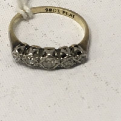 A 18 ct gold ring inset with five diamond chips . Size O .