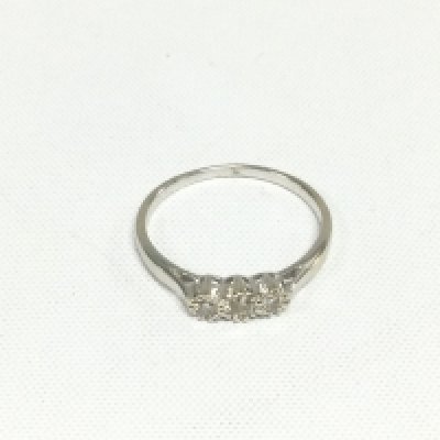 An 18ct white gold three stone diamond ring, approx 2.7g and approx size S. Shipping category A.