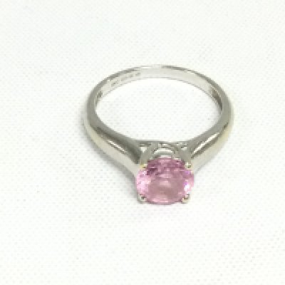 A 14k white gold solitaire ring set with a pink stone, possibly Morganite, approx 3g and approx size K-L. Shipping category A.