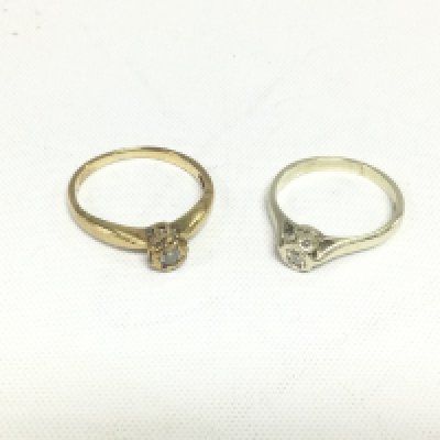 Two 9ct gold solitaire diamond rings, approx total weight 4g and approx sizes M and L. Shipping category A.