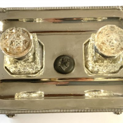 A hallmarked silver desk stand with marks for London 1897, with a pair of later added silver plated and glass inkwells and a silver Yard-O-Led pencil. (A)