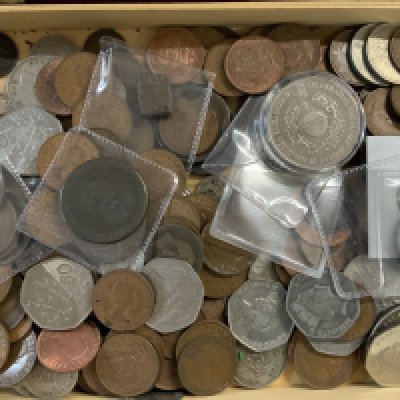 A box of mixed world coins. (A)