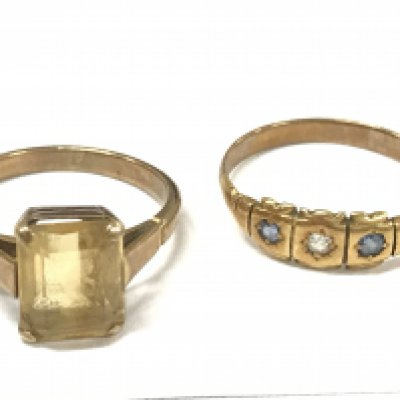 Two unmarked gold rings , 4.9g total weight. Postage cat A