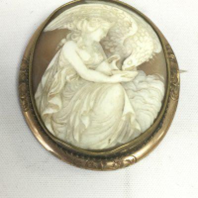 A large cameo brooch in a yellow metal mount, approx length 6.5cm. Shipping category A.