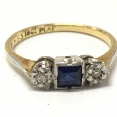 An art deco style 18ct gold and platinum sapphire ring , size M . 2.4 g total weight. Postage category A