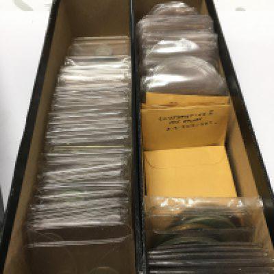 A collection of mixed coins including British coins, Ancient coins, Half Dollars and two German WW2 medals. Postage category A