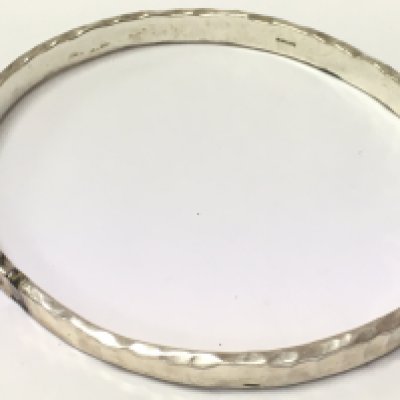A silver bangle , 22.5g total weight. Postage category A